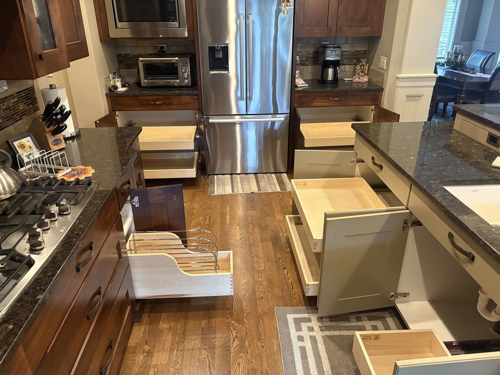 Pull-out shelves open across every lower cabinet in a Treasure Valley kitchen